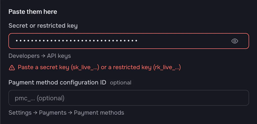 The Stripe key field with a red border and the message 'Paste a secret key (sk_live_…) or a restricted key (rk_live_…)'.